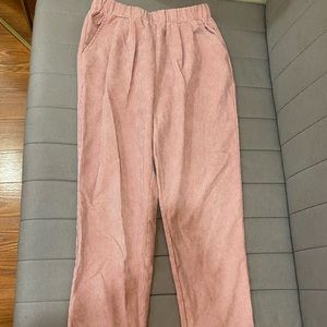 Light pink, corduroy-style pants with elastic band